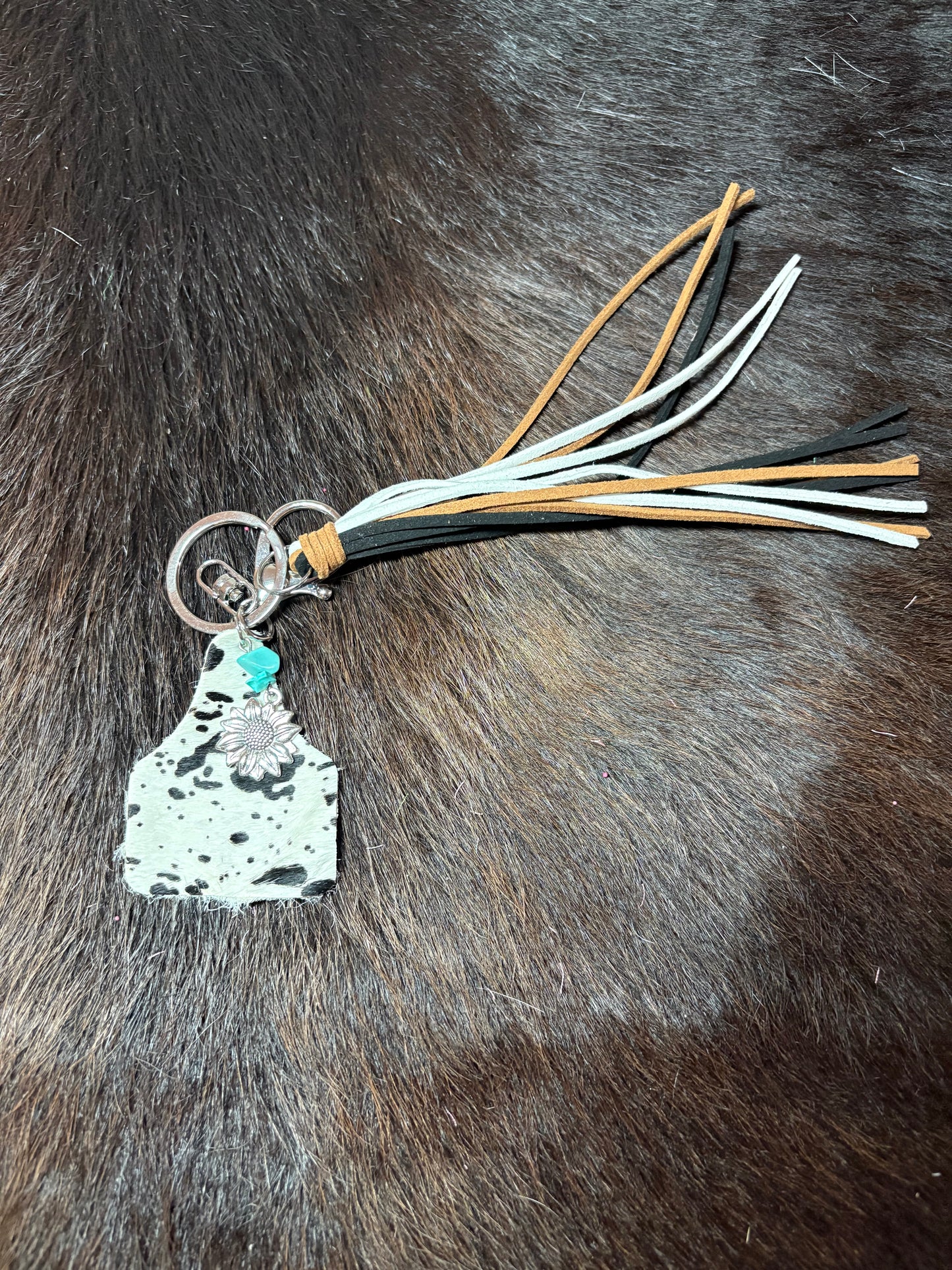 Black and White Cowhide Ear Tag Keychain.